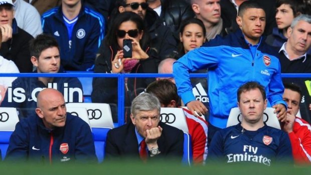 Tough viewing: Arsene Wenger watches on as Arsenal concede six goals to Chelsea.
