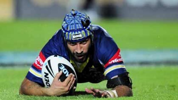 Hot property...Johnathan Thurston scores during North Queensland's win against the Gold Coast last Saturday night. The Cowboys are going all out to try to re-sign him in the face of a huge offer from French rugby.