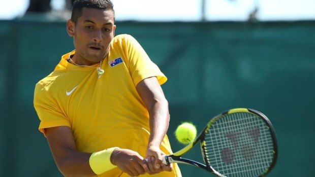 Golden glow: Nick Kyrgios on his way to victory.