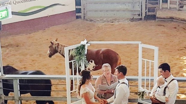 Zoe Watkins and Steven Corrie during their wedding ceremony at the Gracemere Saleyards.