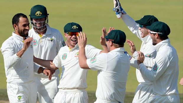 Fawad Ahmed celebrates with teammates after taking the wicket of Rilee Rossouw on day two of the match against South Africa A.