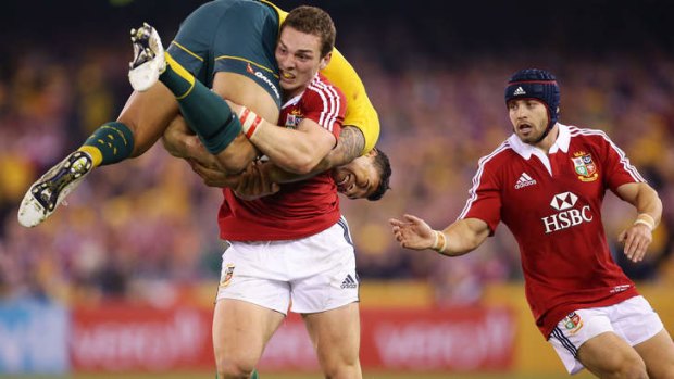 British Lions hangover: George North of the Lions lifts Israel Folau during the second Test.