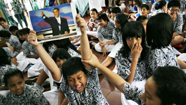 Children at Barack Obama's former school in Jakarta celebrate after being told of his victory.