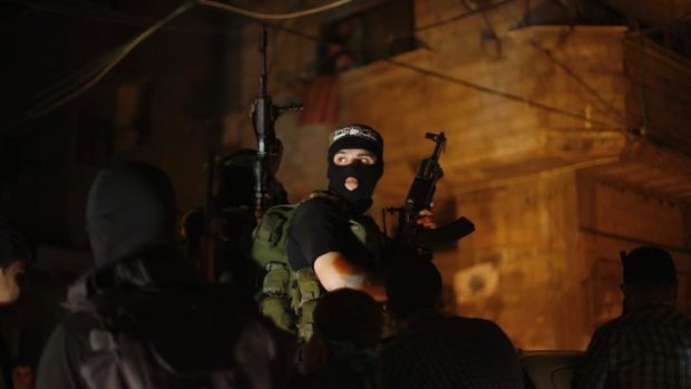 Palestinian Hamas militants celebrate the ceasefire.