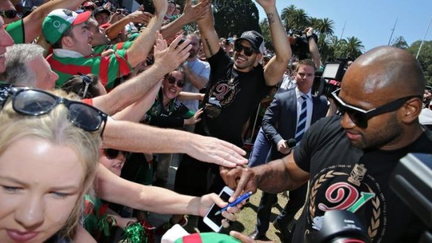 Fan favourite: Lote Tuqiri signs autographs for South Sydney supporters on Monday.