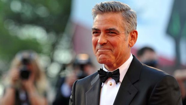 George Clooney entertains journalists at the Venice Film Festival's opening ceremony.