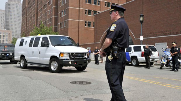 A van carrying Boston Marathon bombing suspect Dzhokhar Tsarnaev arrives at the courthouse for his arraignment.