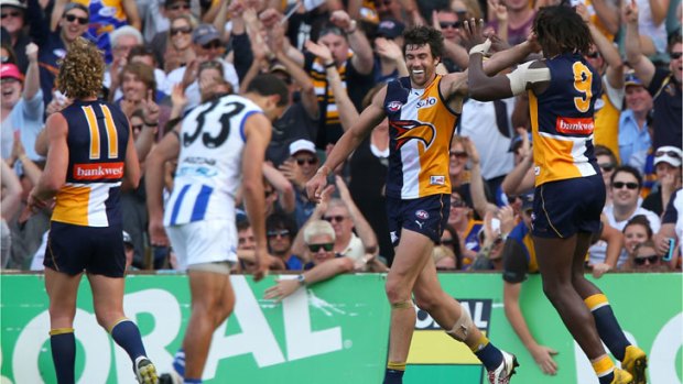 Nic Naitanui and Josh Kennedy celebrate a goal during the Eagles' win over North Melbourne.