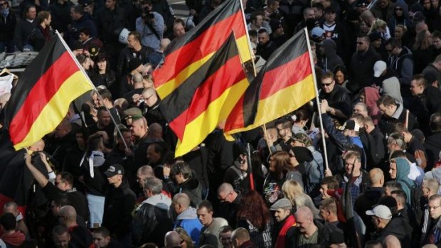 Nationalist gathering: People carrying German flags join a demonstration by "hooligans against Salafists and Islamic State extremists" in Cologne.