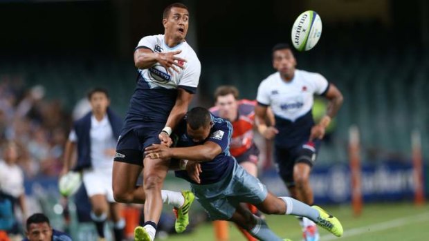 Confident: Peter Betham throws a last-gasp inside ball in the Waratahs' trial against Auckland Blues on February 7.