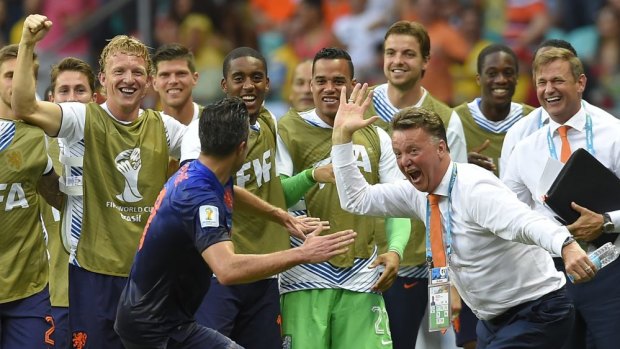 etherlands' Robin van Persie celebrates with head coach Louis van Gaal after scoring against Chile.