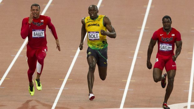 Rivals: Usain Bolt wins the London Games 100m final. Justin Gatlin, right, took bronze. 