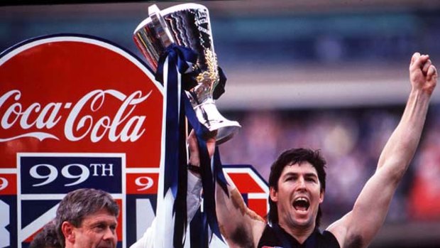 Coach David Parkin and captain Stephen Kernahan raise Carlton's 1995 premiership cup.