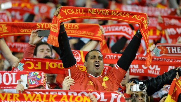Liverpool supporters sing as they watch the match between Liverpool and the Melbourne Victory at the MCG in 2013.