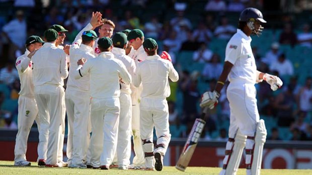 Head and shoulders above the rest ... Jackson Bird celebrates the wicket of Rangana Herath.