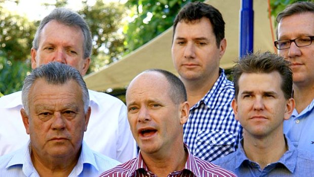 Can-do man? The Liberal National Perty's Campbell Newman and some of the team who will take on Anna Bligh at the next election.