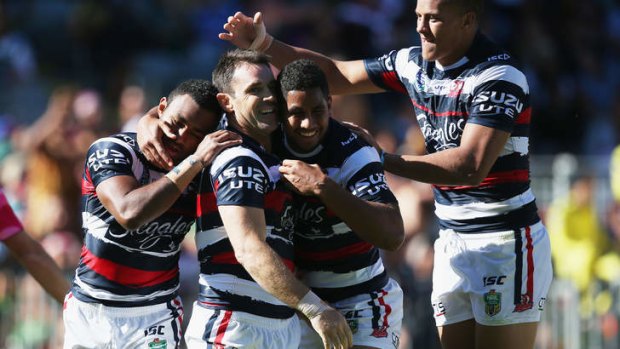 Brad Fittler is mobbed by teammates after scoring an intercept try.