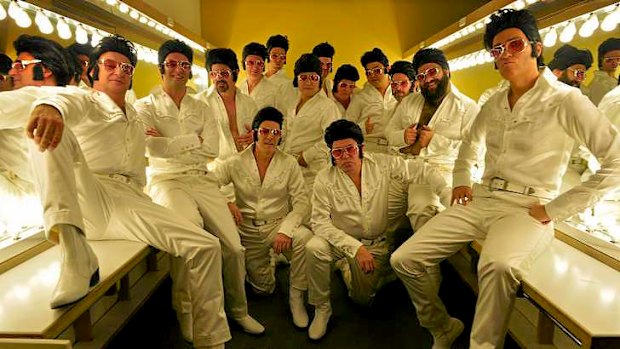 Fourteen Elvises backstage.