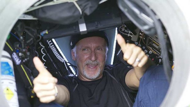 James Cameron gives two thumbs-up as he emerges from the Deepsea Challenger  after yesterday's dive.