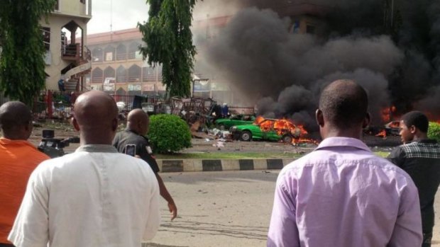 Cars burn in the Nigerian capital.