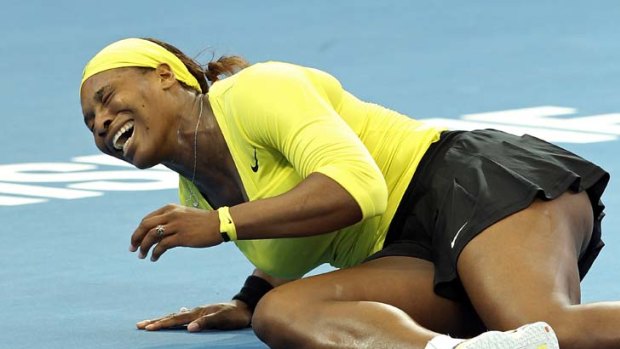 Pain &#8230; Serena Williams grimaces after twisting her ankle.