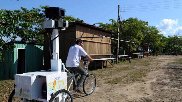 A Google team member rides a Trike with a 360-degree camera system on it, to record the "Street View for the Amazon" in Tumbira Community, Amazonas State.