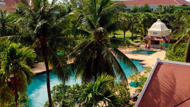 Alluring ... the emerald blue of the hotel pool, which is a replica of the Khmer kings' ancient bathing pools. Photo: Alamy