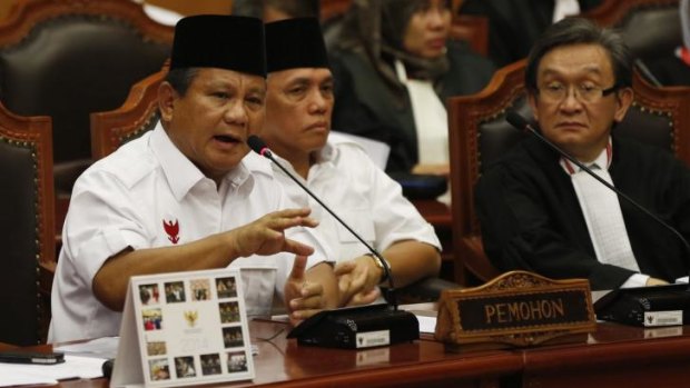 Prabowo Subianto, flanked by his running mate Hatta Rajasa, addresses Indonesia's Constitutional Court on Wednesday, August 6.