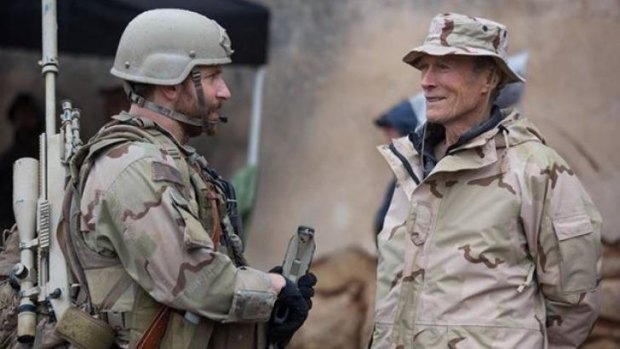 Bradley Cooper and Director Clint Eastwood on set of <i>American Sniper</i>.