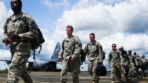 US Army 101st Airborne Division (Air Assault) arrive in Monrovia, Liberia to provide assistance during the Ebola crisis. Returning US army personnel are being quarantined at a US base in Italy.