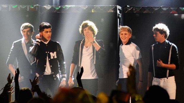 Under the spotlight ... One Direction performing.