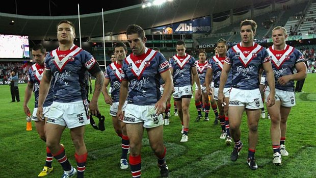 Shattered ... the Roosters trudge off the field.