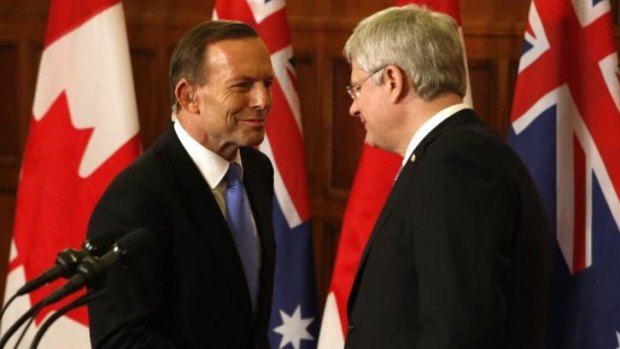 Soulmates: Prime Minister Tony Abbott shakes hands with Canadian Prime Minister Stephen Harper.