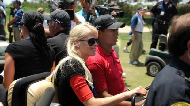 Tiger Woods with his wife Elin Nordegren in June last year.