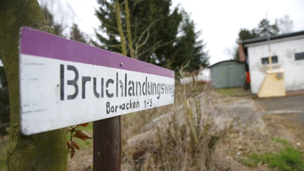 A sign reading'Crash landing path' stands next to field at the LSC Westerwald flight club in Montabaur where the Germanwings co-pilot Andreas Lubitz had been a member.  