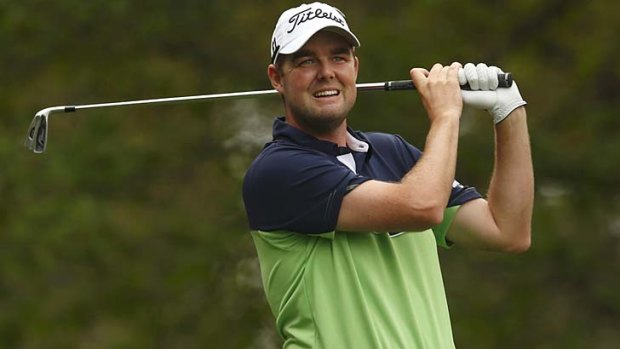 Spot on: Marc Leishman tees off during the first round of the Masters.