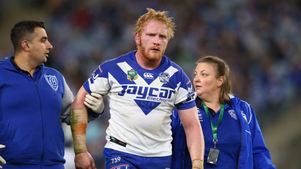 James Graham of the Bulldogs leaves the field after being knocked out during the round 10 NRL match between the Canterbury Bulldogs and the Sydney Roosters at ANZ Stadium on May 15, 2015 in Sydney, Australia. 