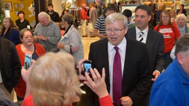There are cameras everywhere as Kevin Rudd, celebrity MP, gets something of a hero's welcome at the Corio Shopping Centre on his tour of Geelong.