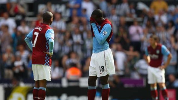 Ashley Young and Emile Heskey of Aston Villa look dejected during the Barclays Premier League match against Newcastle United.