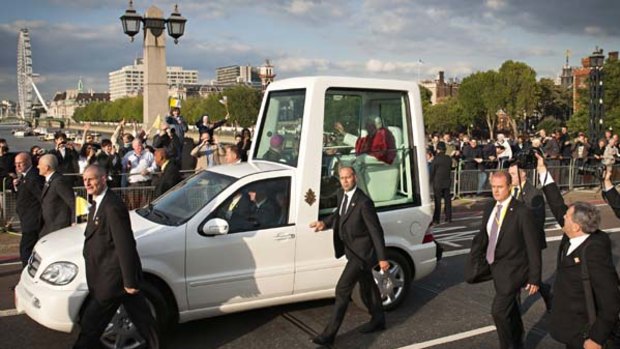 The Popemobile crosses Lambeth Bridge in London.