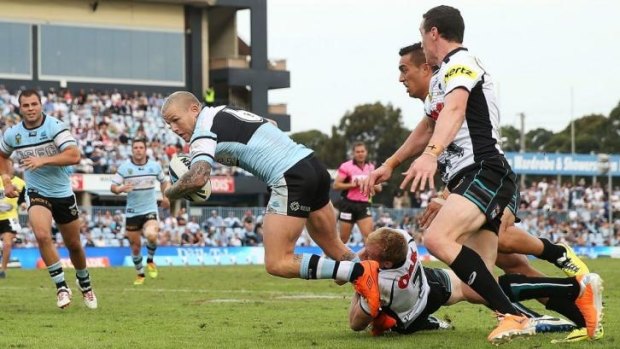 Injury try: Todd Carney scores the four-pointer that caused him to limp off the field clutching his leg.