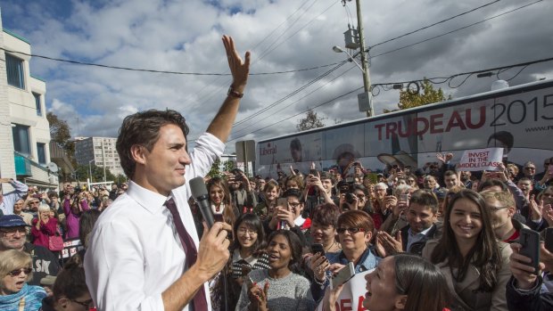 Trudeaumania mark II: New Canadian Prime Minister waves to supporters on a campaign stop last week. 