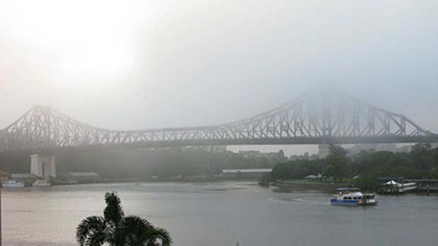 Heavy fog blankets Brisbane's Story Bridge this morning.