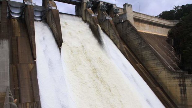 Swollen ... Warragamba Dam spills over on Monday.