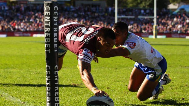 Dean Whare of the Sea Eagles scores a try during the round nine NRL match between the Manly Sea Eagles and the Canberra Raiders at Brookvale Oval yesterday.