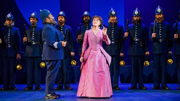 Sergeant of Police Jonathan Lemalu and Claudia Boyle as Mabel in the English National Opera's <i>Pirates of Penzance</i>.