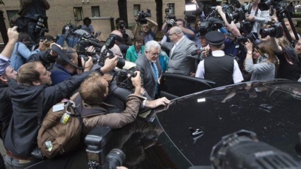 Centre of the storm: Rolf Harris leaves the court as a guilty man.