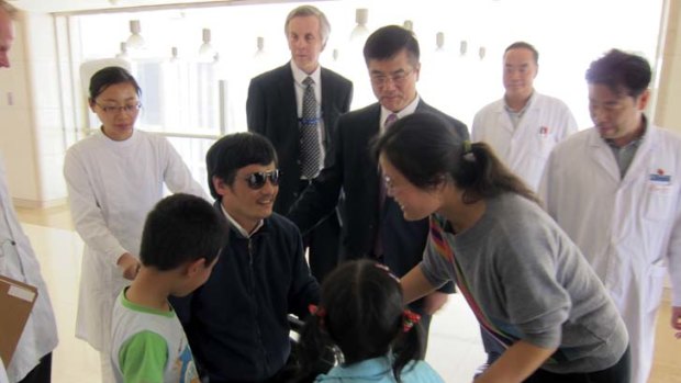 Official photo &#8230; Chen Guangcheng is reunited with his family in a photograph taken at a Beijing hospital on Wednesday and released by the US embassy.
