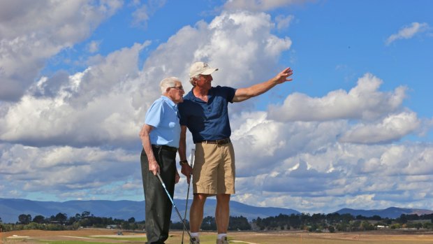 Greg Norman, right, shows Les Smith the 27-hole course he designed for the Eastern Golf club in Yering.
