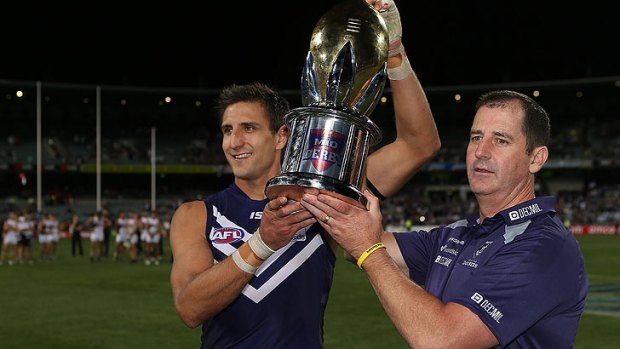 Matthew Pavlich and Ross Lyon hold aloft the western derby trophy - but the Dockers skipper may come under Match Review Panel scrutiny.